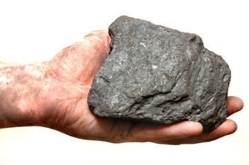 Naklejka premium Coal in miner's hand