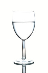 Wineglass half-full of water isolated on white