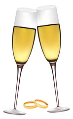 Two glasses of champagne with wedding rings