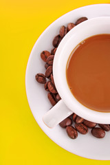 Small white cup of coffee with coffee grain on red background