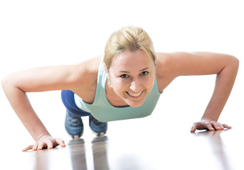 young woman doing push-ups