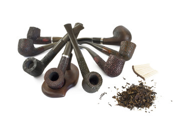 tobacco pipes, tobacco and matches on a white background