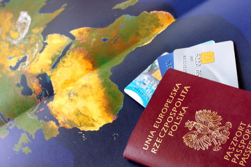 World map, polish passport and credit cards