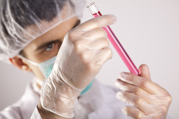 Scientist in laboratory examinates samples and chemical