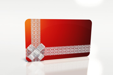 PRESENT WITH WHITE LACE RIBBON AND RED GIFT CARD