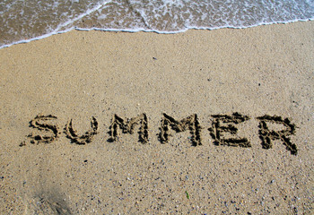 Summer sign on the sand