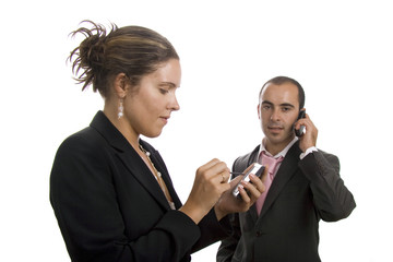 A woman holding a PDA and a man with cellphone isolated on white