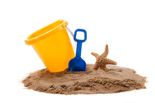 Bucket On A Beach With A Shovel And Starfish