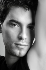 Obraz premium black and white young man face portrait