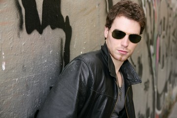 Obraz premium rocker rock star young man sunglasses