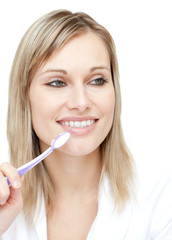 Radiant woman holding a toothbrush
