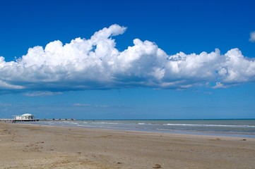 Sea landscape with blue sky and fluffy clouds