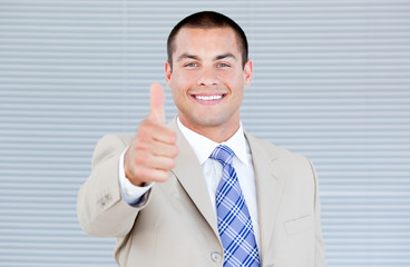 Cheerful businessman with a thumb up