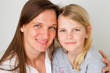 smiling mother with daughter