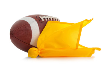 Football and penalty flag on white