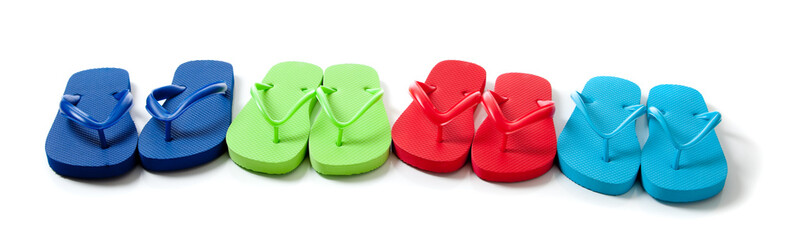 Colored flipflops on a white background