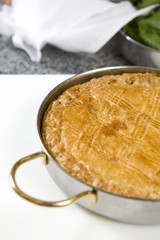 fresh home made spinach and artichoke pie on a plate