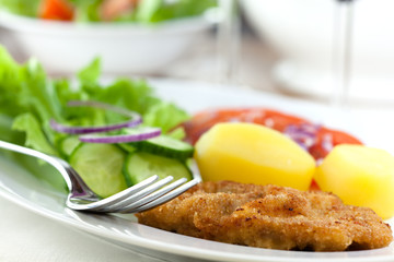 Schnitzel with potatoes and salad