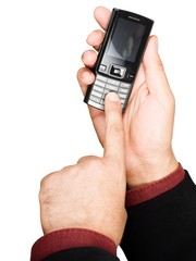 Businessman's hand holding a cell phone - isolated on white