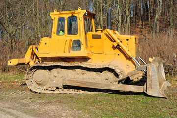 Yellow dirty bulldozer