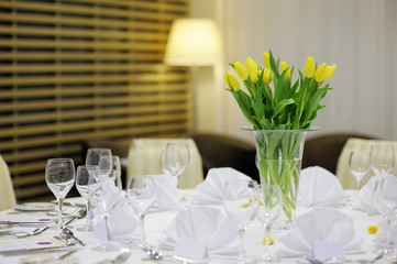 Yellow tulips on a festive table