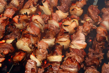Meat cooking on a skewer