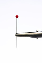 pin held in crocodile clip