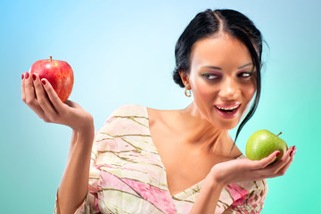 Young woman with two apples