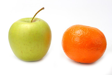 Red mandarin and green apple