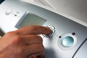 finger presses the button