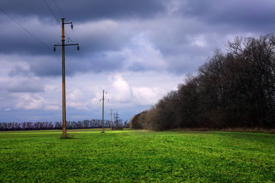 green fild with rain clouds