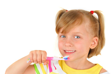 Cute little girl is brushing teeth