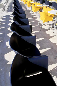 Row of blue and yellow chairs