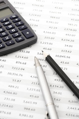 Pencil, pen and calculator close-up