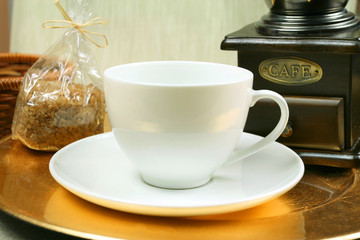Obraz na płótnie Canvas Coffee cup and grinder