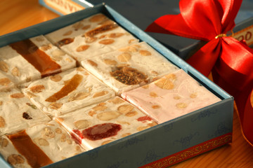 Obraz na płótnie Canvas Sweet nougat bars in box