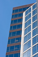 White and Brown Building with Blue Glass