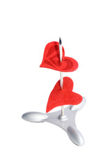 Two red hearts on a paper spike (isolated on white)