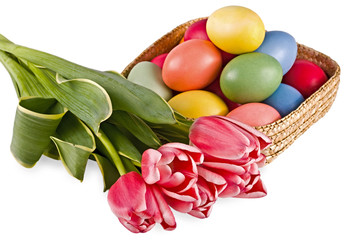 Obraz na płótnie Canvas Basket with eggs and flowers