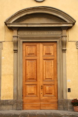 Wooden door with a stone door frame.