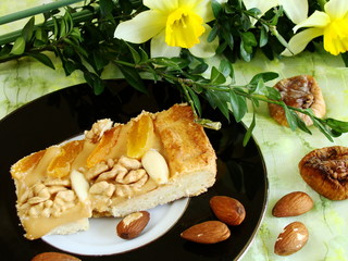 cake with almonds, figs, apricots, nuts and with jonquils