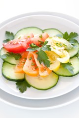 fresh salad with yellow, orange and red tomatoes