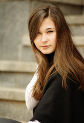 Portrait of young woman with long hair
