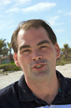 average guy on beach talking