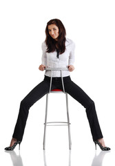 Fototapeta premium Girl sitting on the bar chair