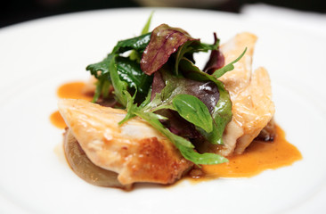 Chicken breast with sauce and lettuce