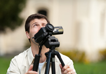 Caucasian man filming