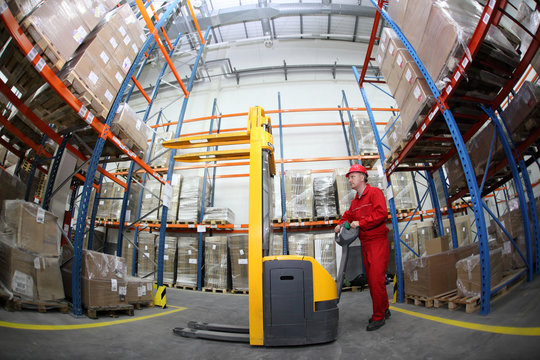 manual forklift operator at work in warehouse
