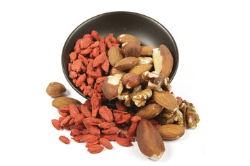 Goji Berries and Nuts Spilling from a Bowl