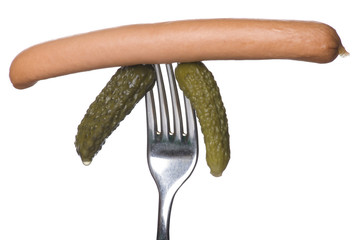 frankfurter and cucumber on fork